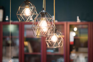 Three cage-style hanging lamps