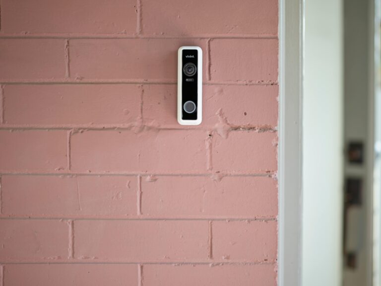Vivint Doorbell Camera Pro installed on a pink brick wall