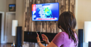 Woman using VPN on her smart TV